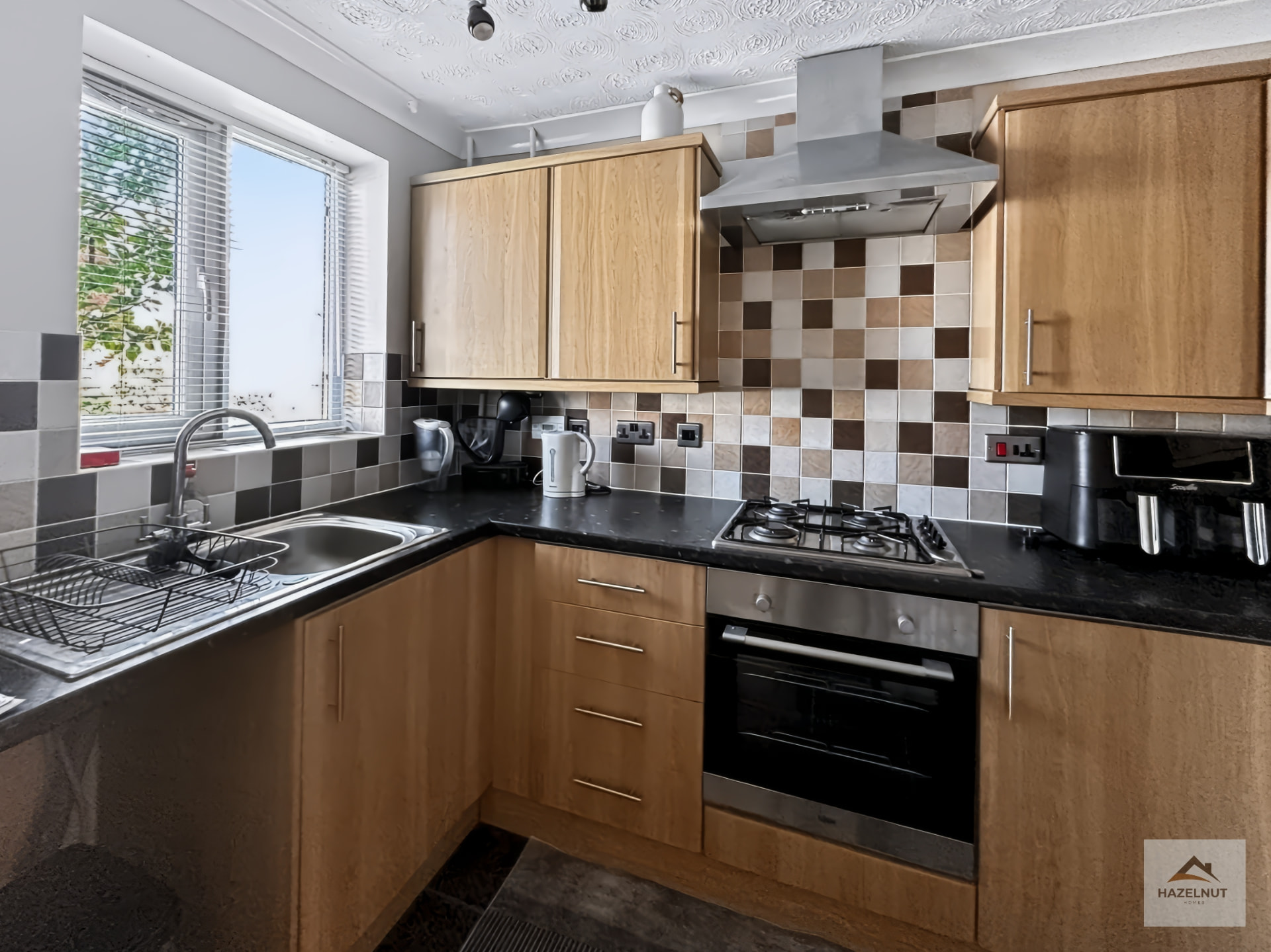 Fitted kitchen with wood-tone cabinetry at 8 Curlew Avenue