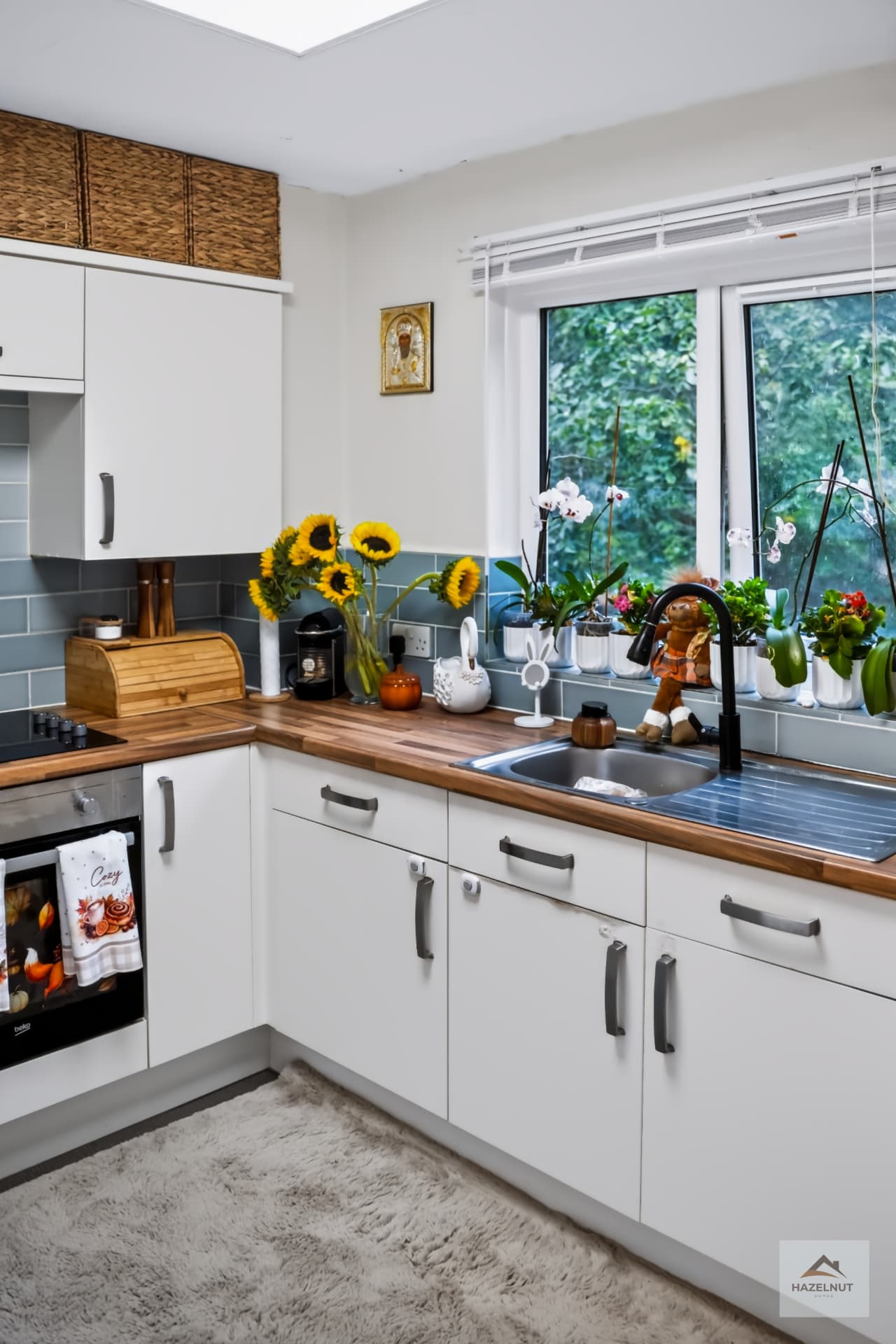 Kitchen with worktops and garden outlook